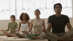 group of beginners meditating together