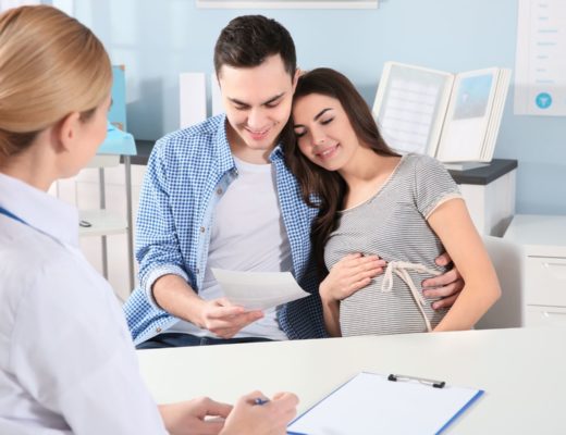 pregnant couple discussing weed with their family doctor